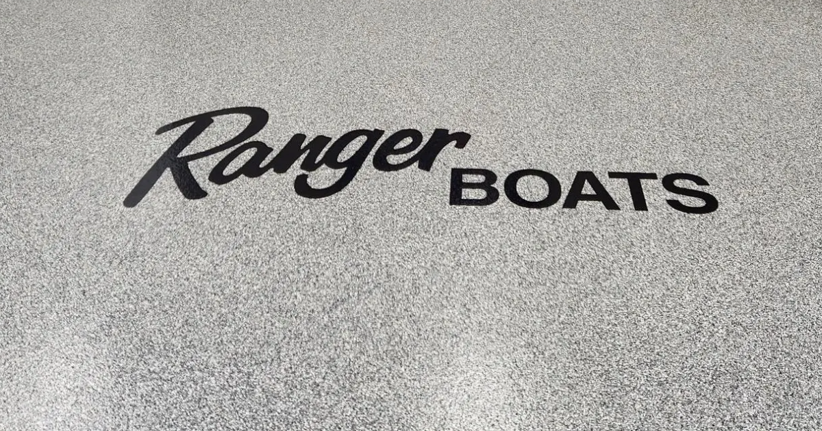 A close up of the ranger boat logo on a boat.