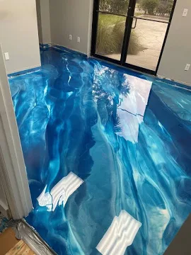 A floor that looks like water with blue and white colors.